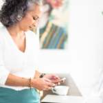 woman reading information from her phone